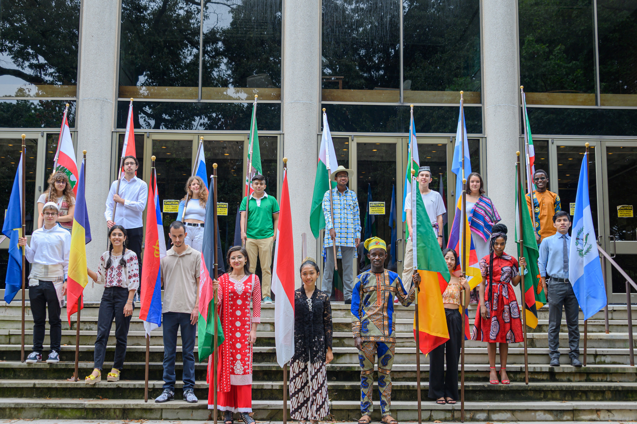 Group of international students at Berea College holding their country's flag