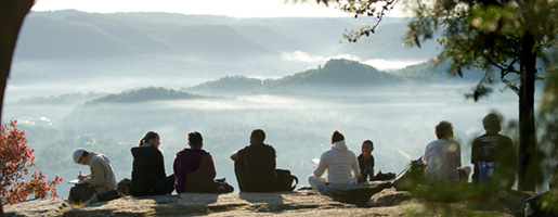 Group of students looking out at mountainous landscape