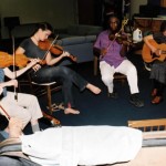Group of five people playing string instruments