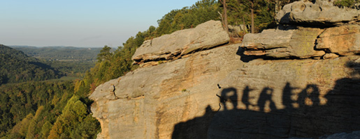 Students form the word "Berea" using their shadows on the mountainside