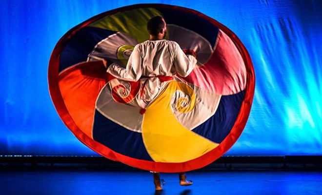 Dancer performing with a circular skirt