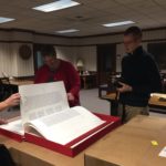Ben Groth, Chaplain Intern, and Rachel looking at text and pictures