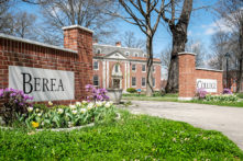 Berea College sign on campus in the spring