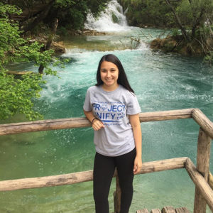 Education Abroad girl standing in front of a river