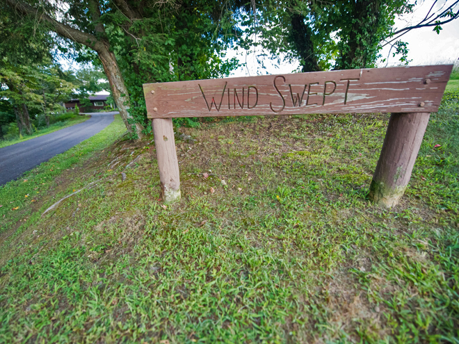 Outdoor sign reads "Wind Swept"