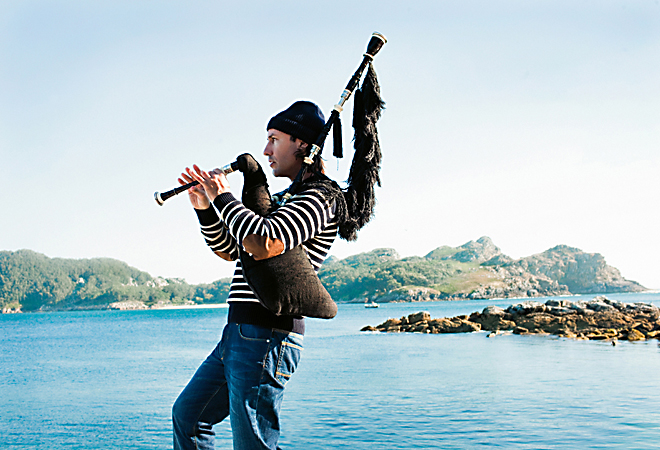 Galician piper Carlos Nunez at Cies Islands, Vigo, Spain