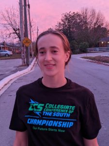 Picture of Shavon standing in a road at sunset.