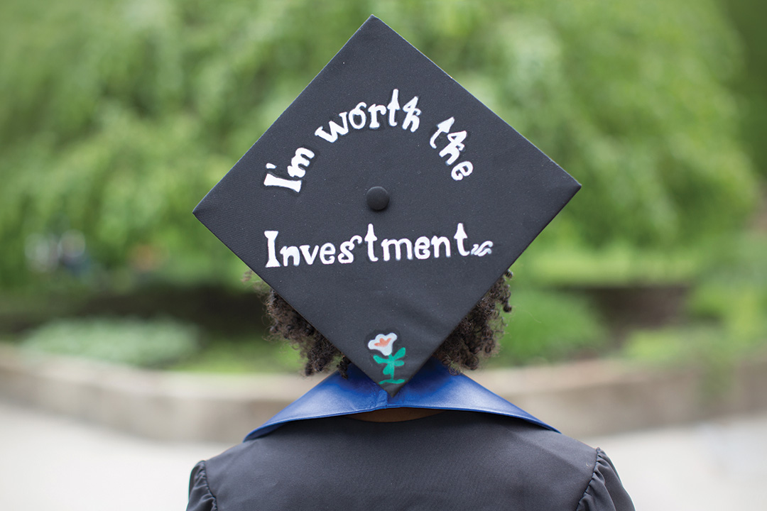 Graduation cap with "I'm worth the investment"