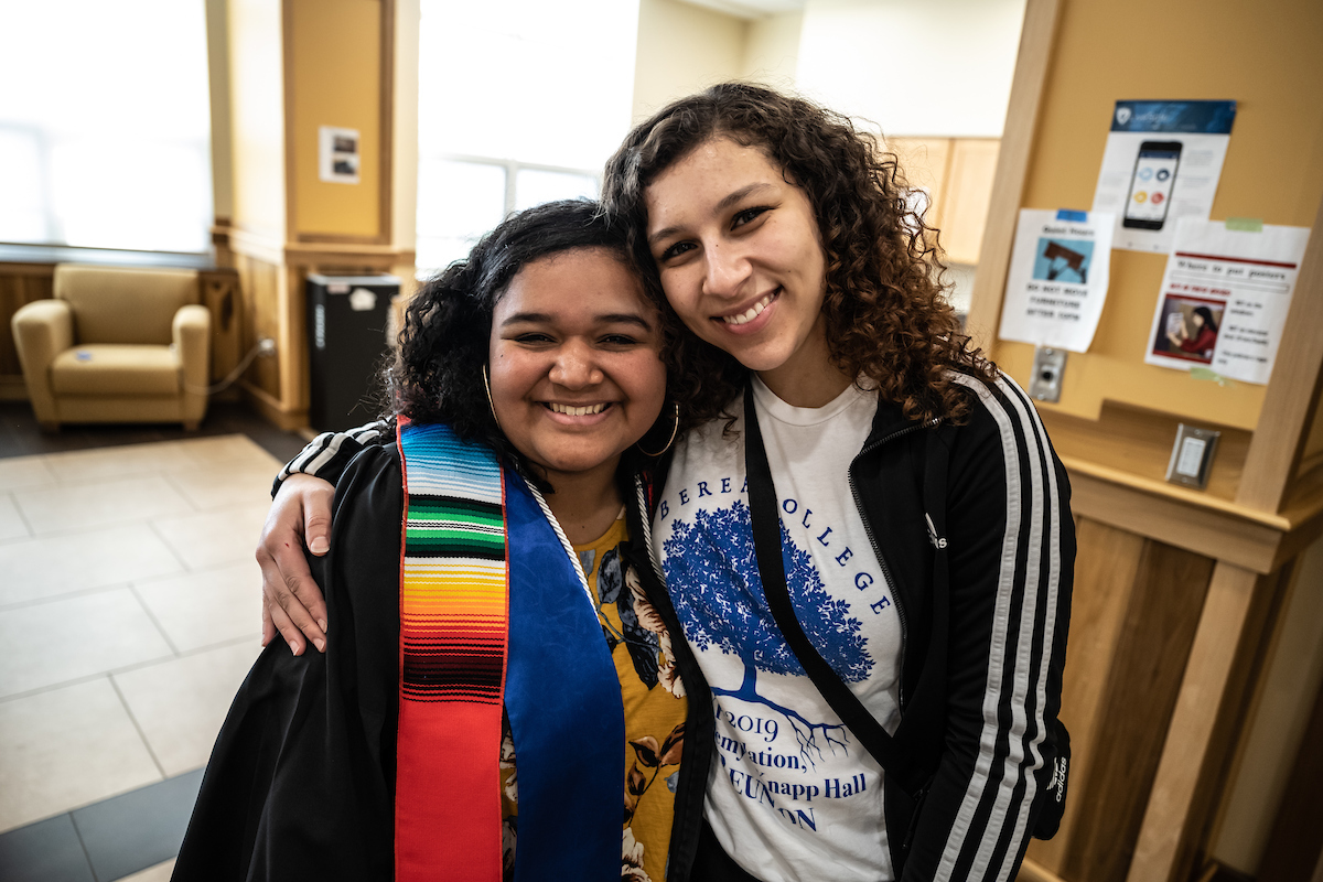 YA website photo two students hugging each other