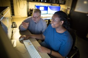 Student and labor supervisor at computer