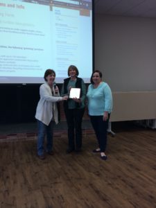 Institutional Research receiving Green Office Certification Plaque
