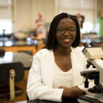 A student, Olamide Adejumo working in the science lab