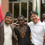 Students from Nepal, Burundi and South Korea taking picture together