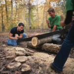 Students cutting trees in the woods of Appalachia