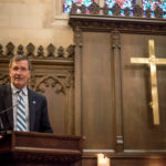 president Lyle Roelofs giving speech in the chapel