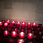 lighted candles at the entrance of chapel