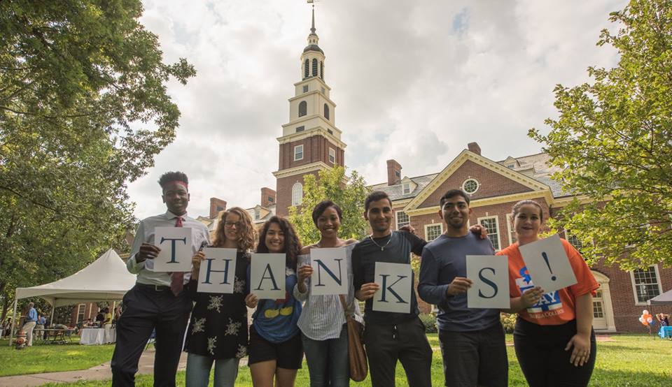 Students holding up a "Thanks!" sign