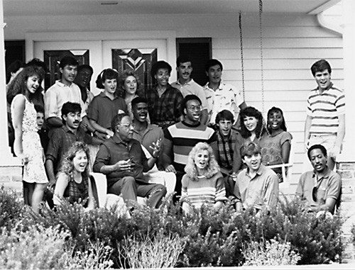 Haley on porch with students.