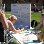 An informative festival booth about herbicides