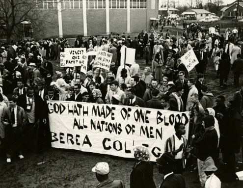 Historical photo of Berea students in Selma holding a sign with the College motto