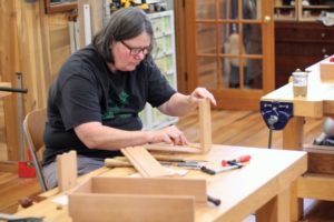 Student laying out dovetails